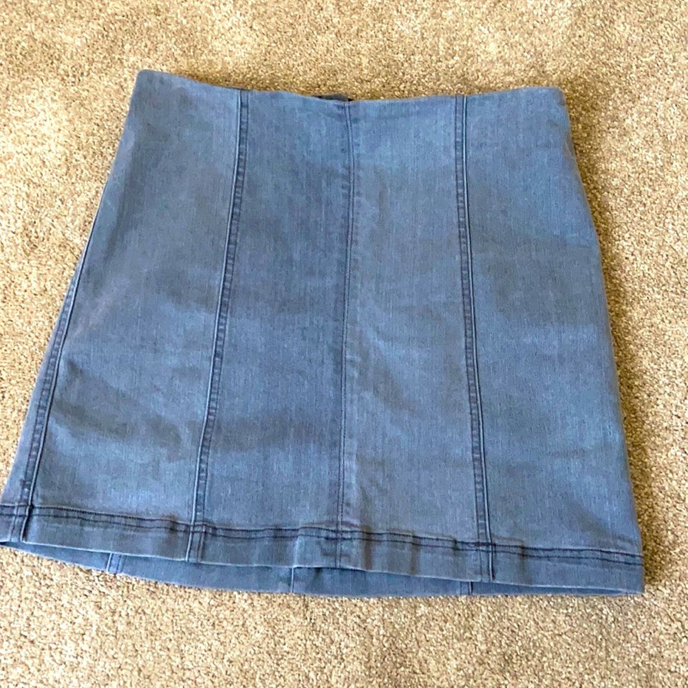 Gray denim mini skirt. Forms to body, stretchy!